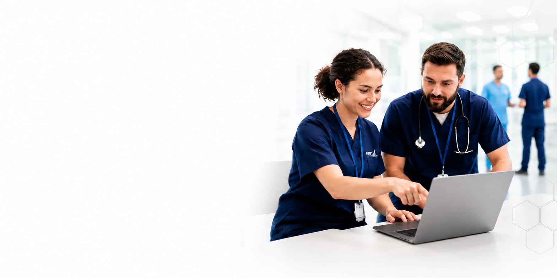 Acute medicine colleagues discussing improvement work at a laptop